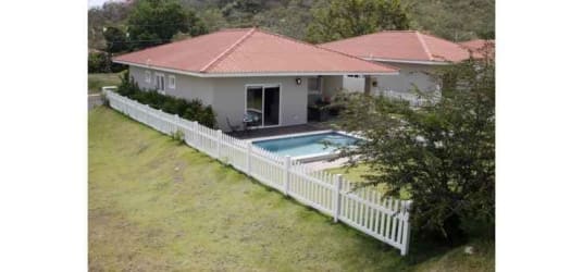 Modern country house with patio, pool and outdoor seating at Villas del María Bejuco Panama