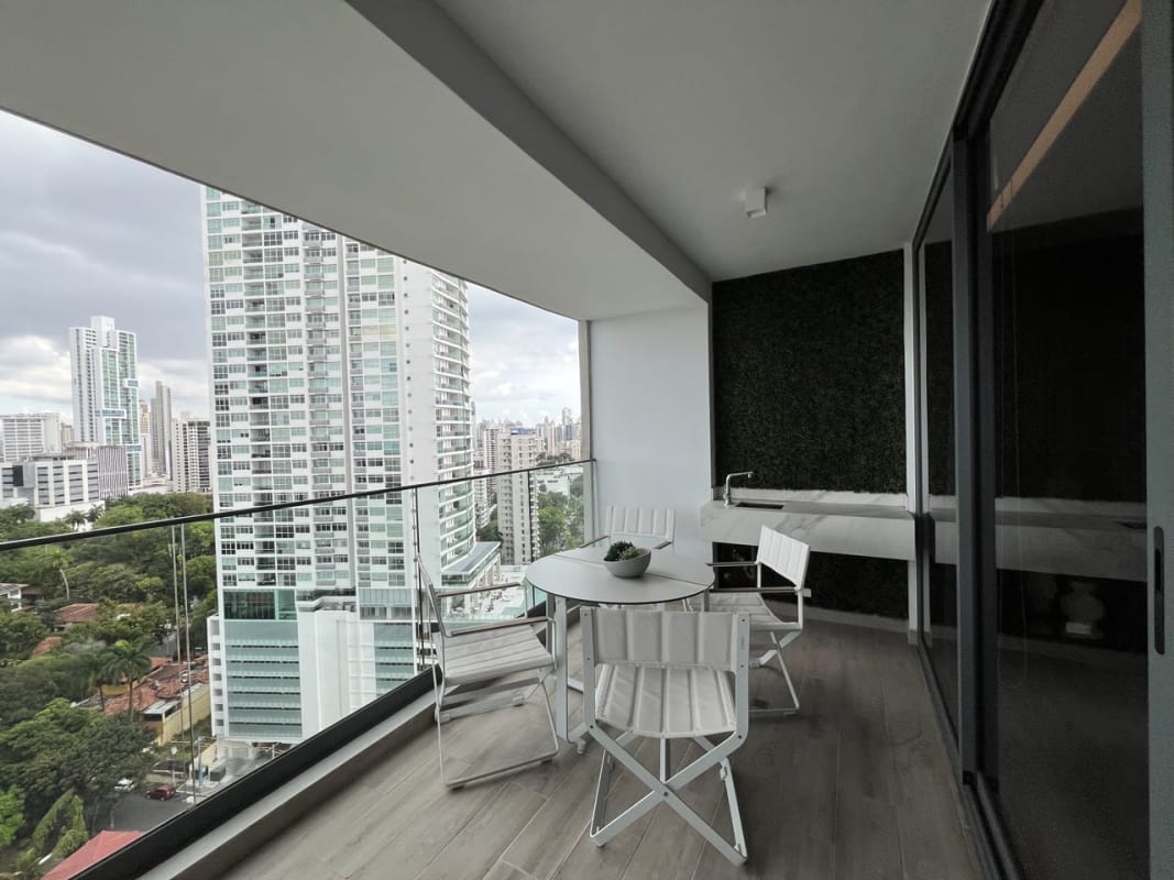 Modern marble-floored living and dining area with skyline views at PH Prestige Panama City