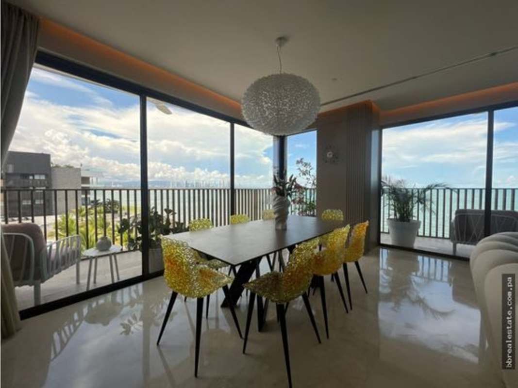 Open dining space with vibrant chairs and stunning Pacific views PH Seascape Ocean Reef Panama