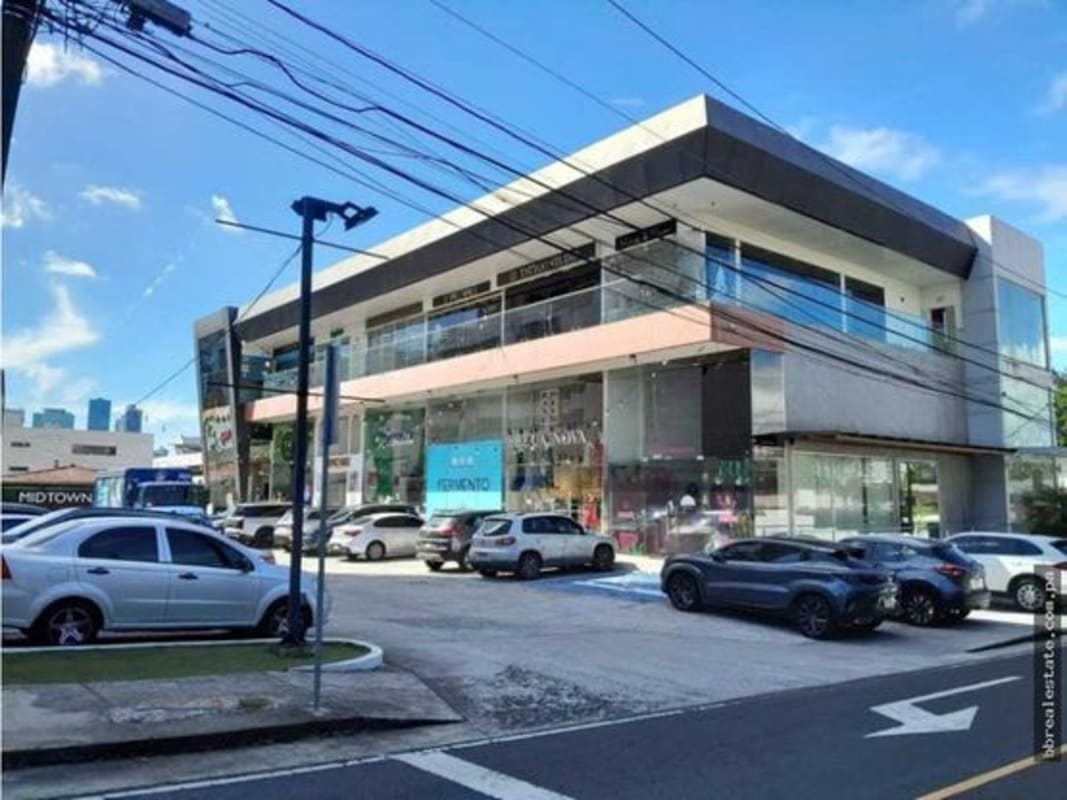 Multi-level retail units with glass facade and balconies at Midtown Plaza San Francisco Panama