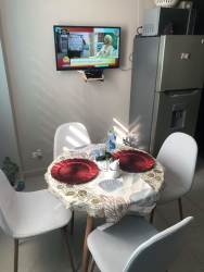 Bright living and dining room fully furnished in beach apartment PH Ocean View San Carlos Panama