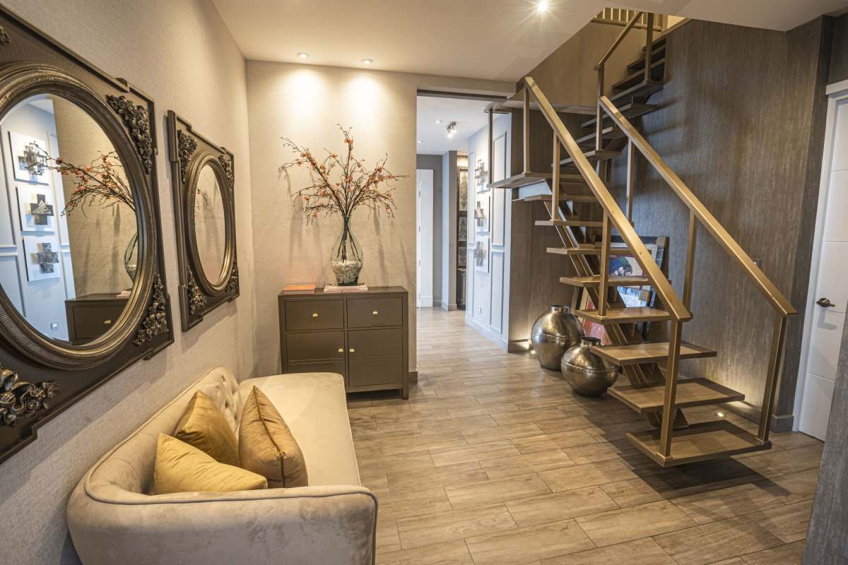 Elegant master bathroom with marble finishes, jacuzzi tub and large windows with ocean view