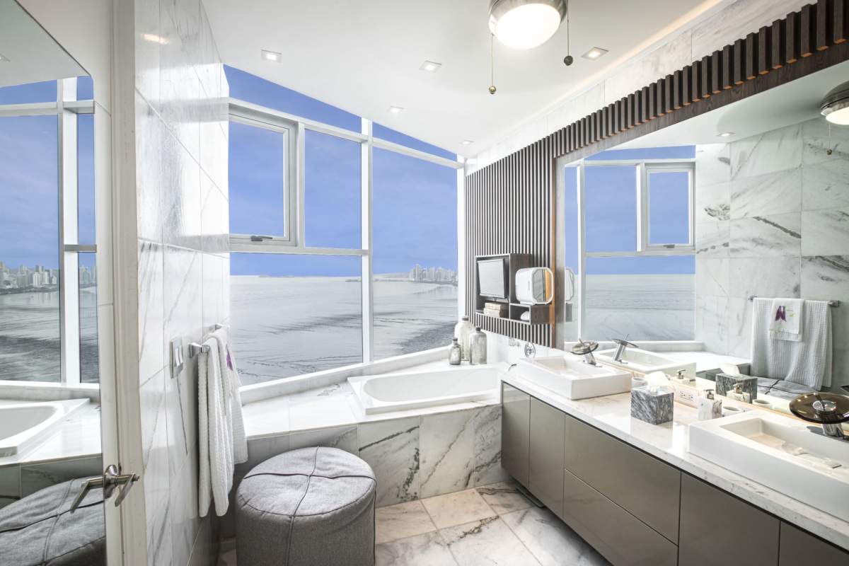 Spacious living-dining room with marble floors, dome ceiling and panoramic views in penthouse