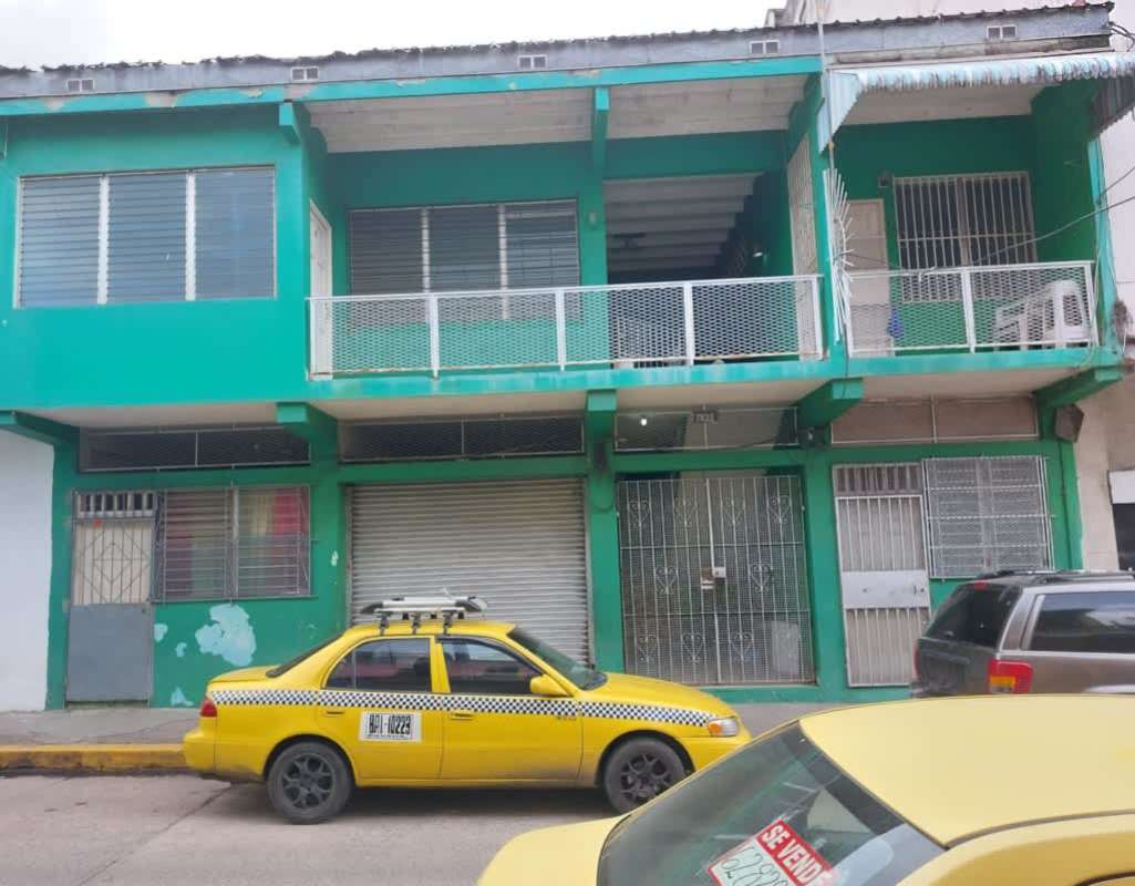 Two story colonial commercial residential building teal color Casco Viejo Panama