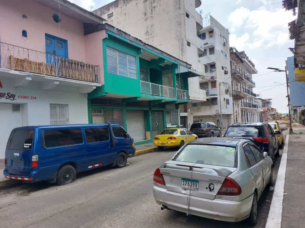 Street perspective of colorful colonial mixed-use building Casco Viejo Panama