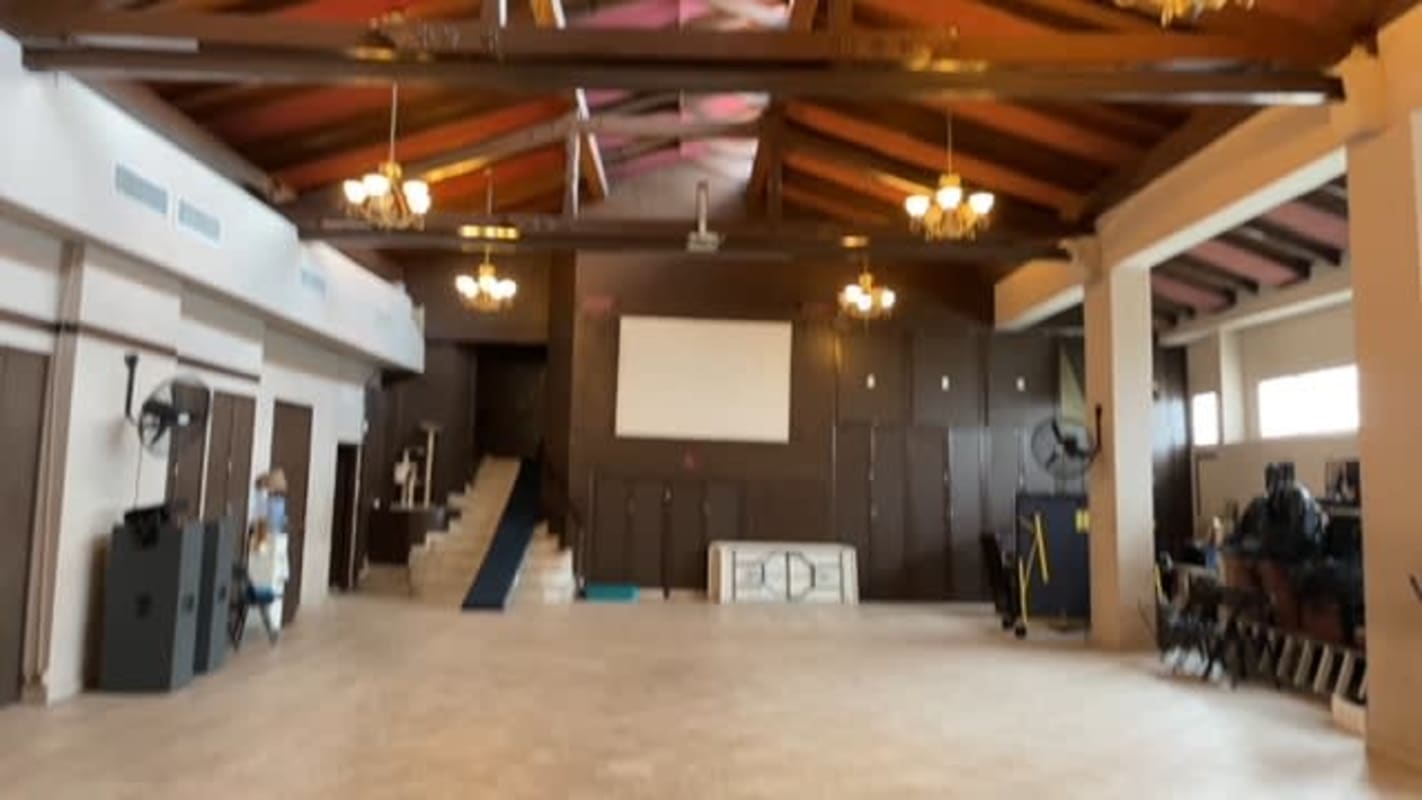 Spanish Colonial Revival commercial building corner with cityscape background Panama