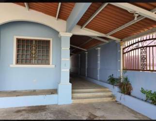 Front entrance with carport, decorative window grille, security gate in Valle Dorado
