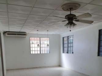 Bright tiled living room with AC, fan, and grid ceiling in furnished house Panamá Oeste