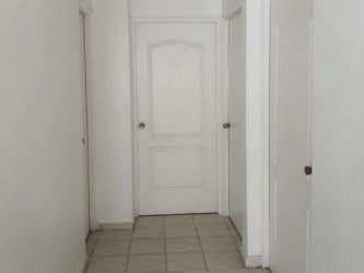 Minimalist corridor with tile floor, white doors in house for rent La Chorrera
