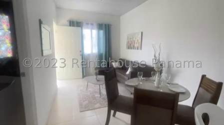 Kitchen with granite countertop, window, white cabinets in new house Altos de la Mitra La Chorrera