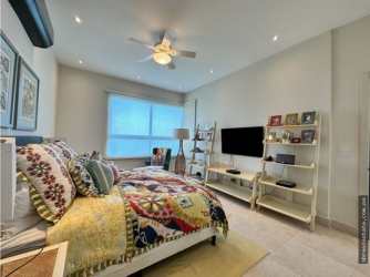 Modern bathroom with glass shower and vanity in beach apartment Panama