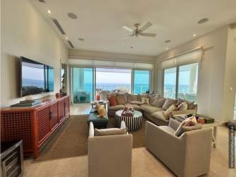 Luxury beachfront apartment living room with ocean view terrace at Bijao Panama