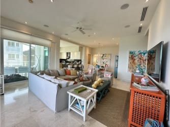 Contemporary kitchen with island, appliances at Bijao Beach Residences Panama