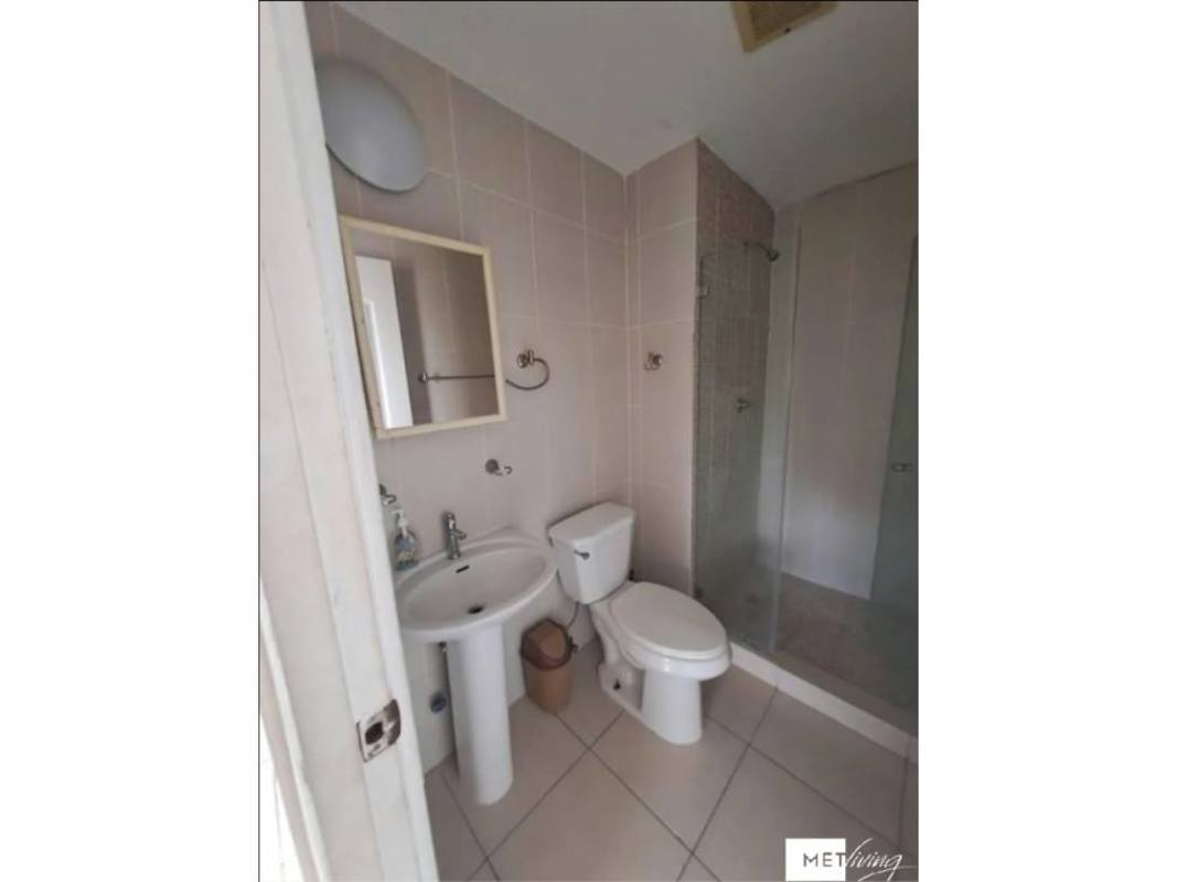 Minimalist bathroom with pedestal sink glass shower tiled floor PH Mirador Siena Panama