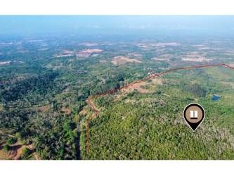Panoramic aerial view of large countryside development site in western Panama country side with forest and cleared patches