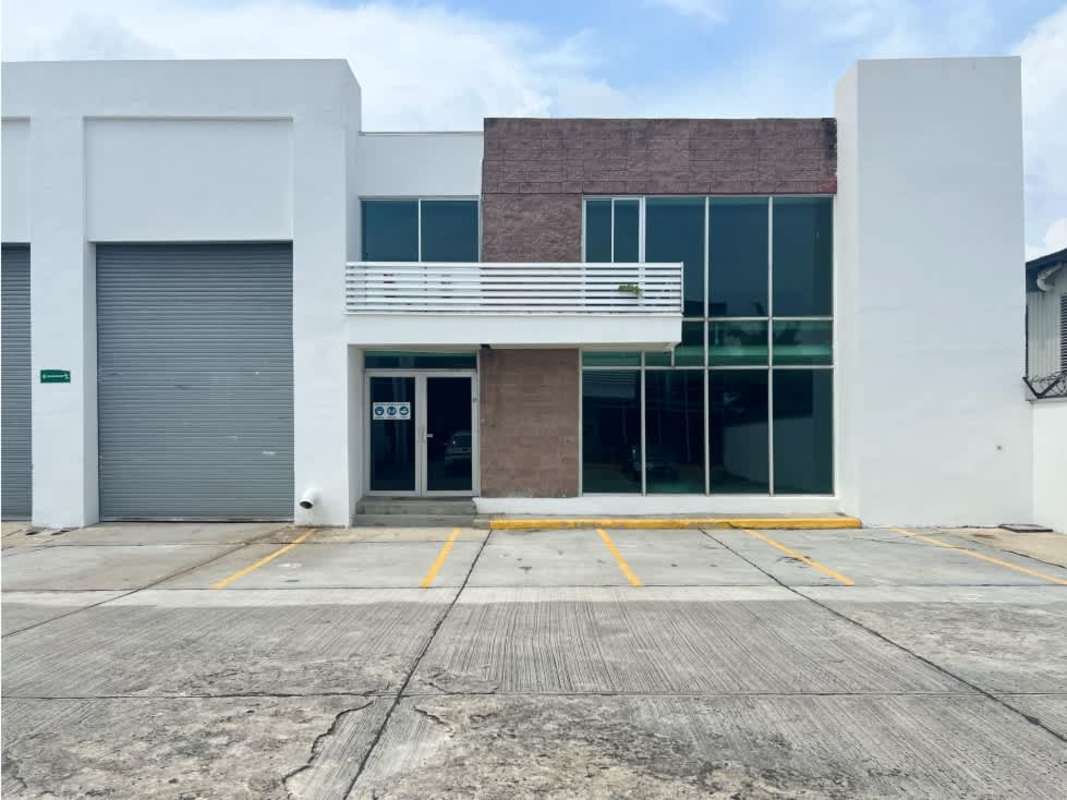 Interior staircase with metal railings concrete stairs large window warehouse commercial Panama