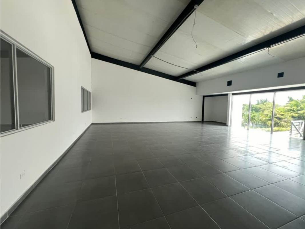 Empty commercial warehouse open space tiled floor exposed beams Panama City