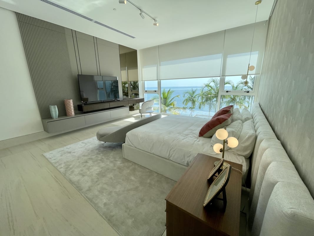 Second bedroom featuring large windows, built-in closet, city views in Ocean Pearl Tower Panama