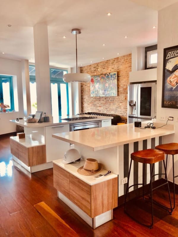 Kitchen with brick wall and island Casa Jeronimo Casco Viejo Panama