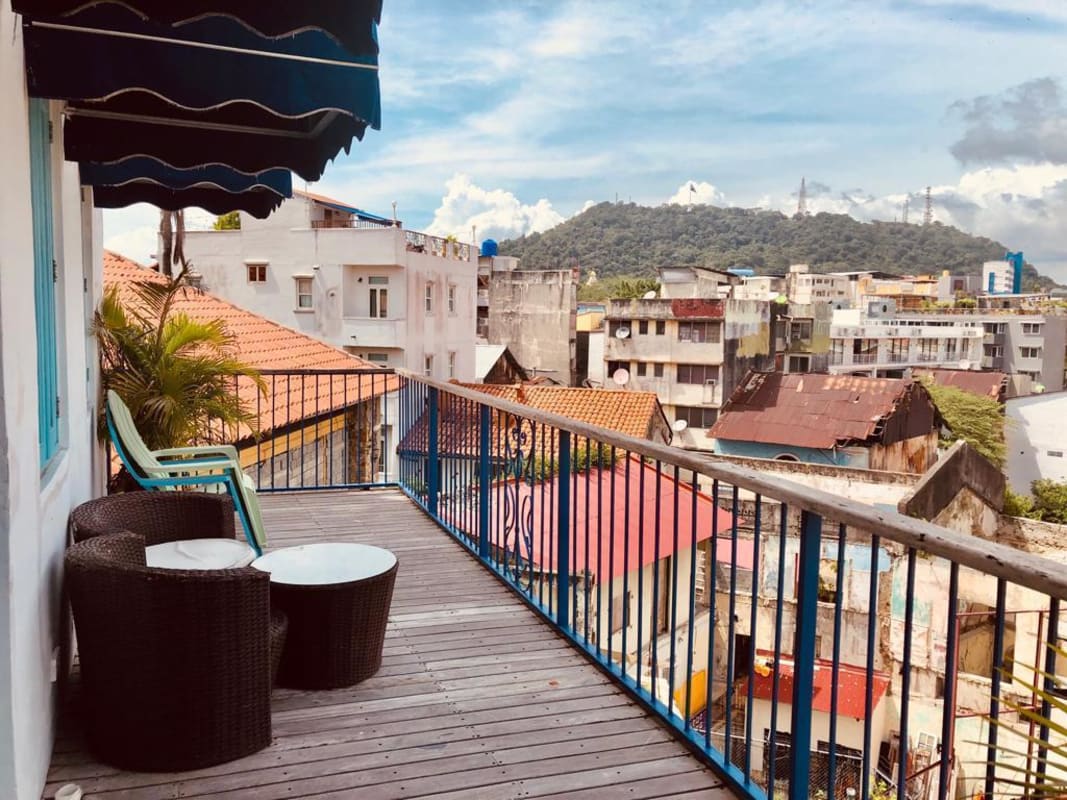 Open plan space with kitchen and brick wall Casa Jeronimo Casco Viejo Panama