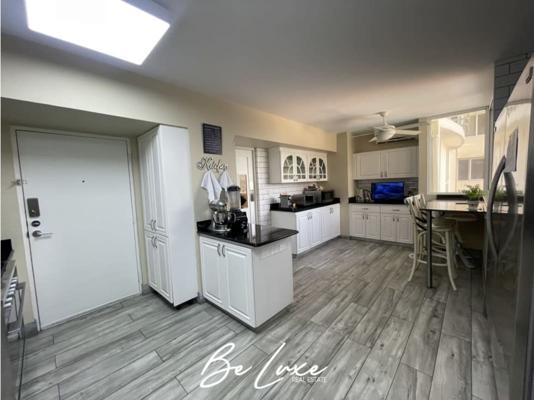 Contemporary kitchen with granite countertops and modern appliances in Punta Pacífica Panama