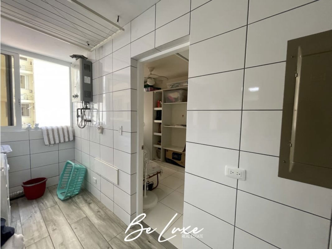 Bright laundry room with water heater and window in Punta Pacífica Panama