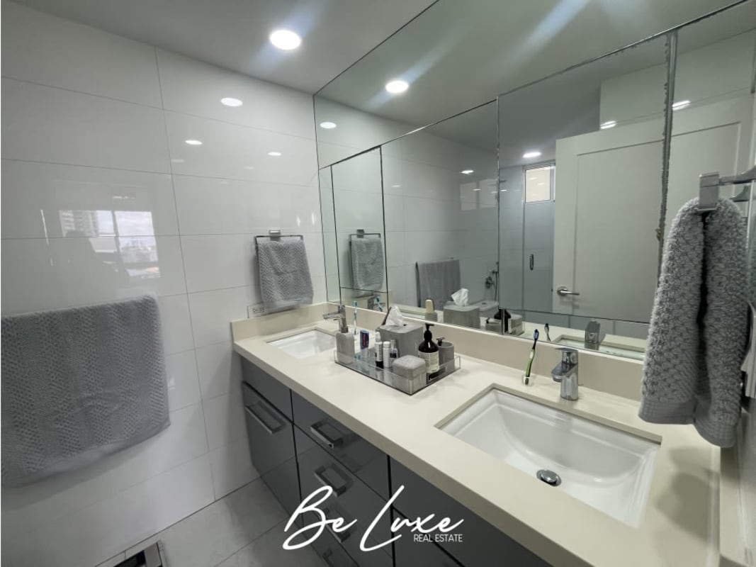 Bathroom with glass-enclosed shower, large mirror, and modern vanity Punta Pacífica Panama