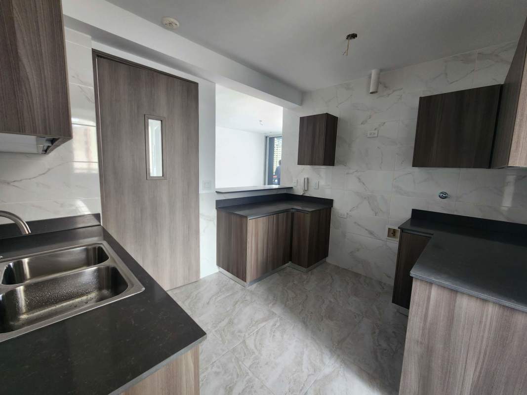 Bedroom with built-in closet, large window and porcelain flooring PH Luxor Tower