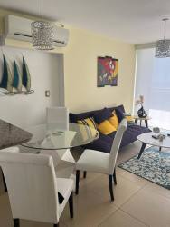 Modern kitchen with granite countertops and appliances at El Palmar Residences San Carlos