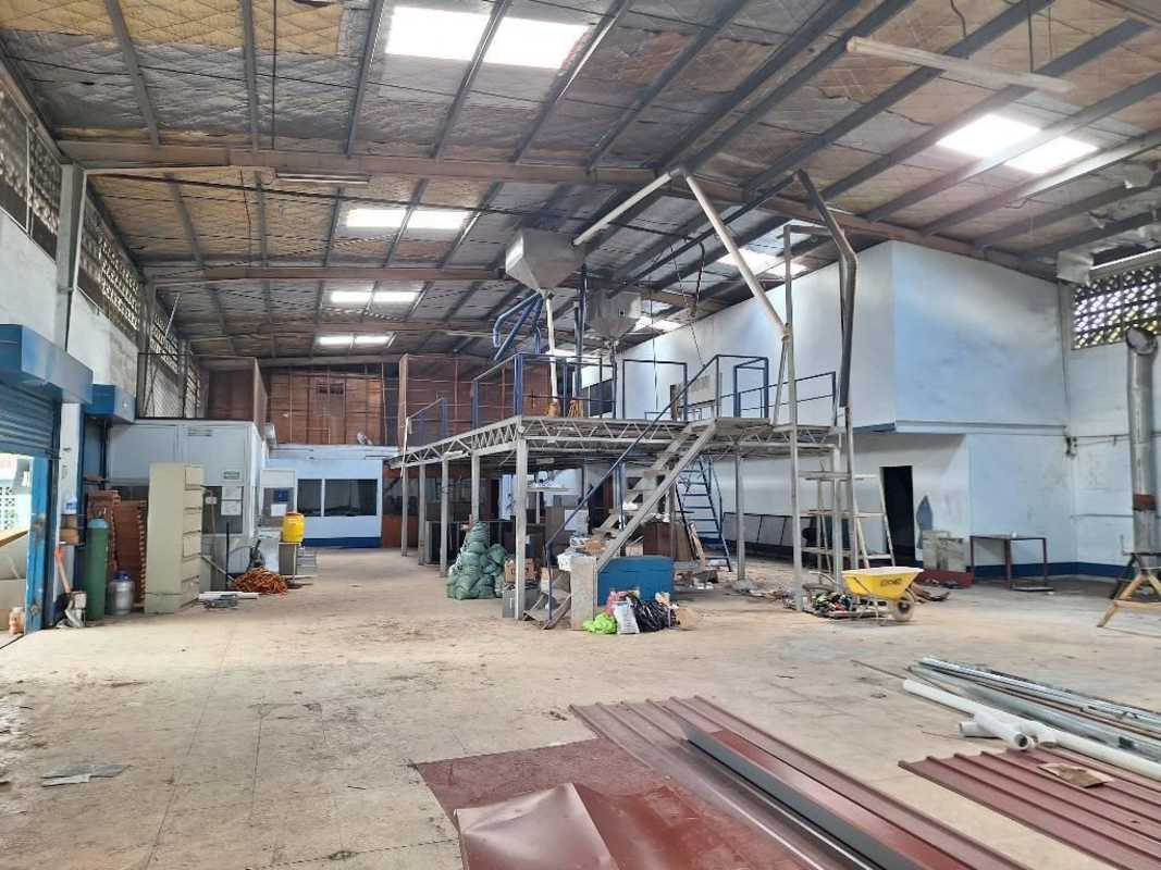Open interior of warehouse with lights and concrete floor Juan Diaz Panama