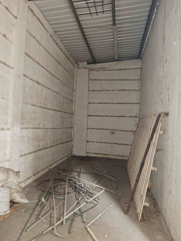 Interior of Panama warehouse showing mezzanine level high ceiling concrete