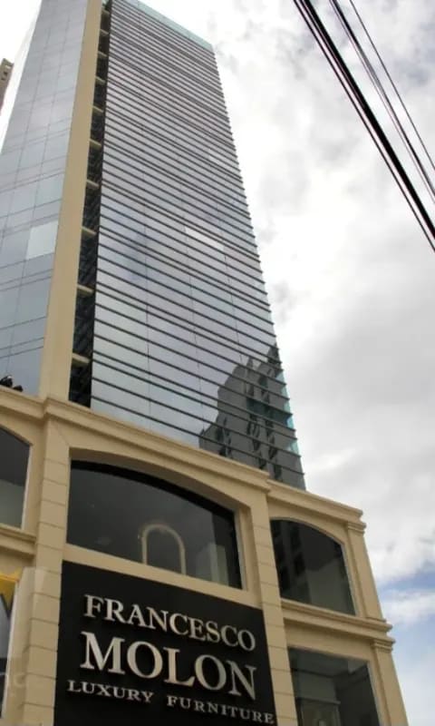 Tall modern glass skyscraper with Francesco Molon furniture showroom in Obarrio Panama City