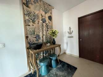 Entry foyer with nautical theme, sea-life curtain, coastal decor in Vista Mar condo Panama