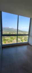 Bright empty space with panoramic windows to mountain and ocean PH Malibu Gorgona Panama