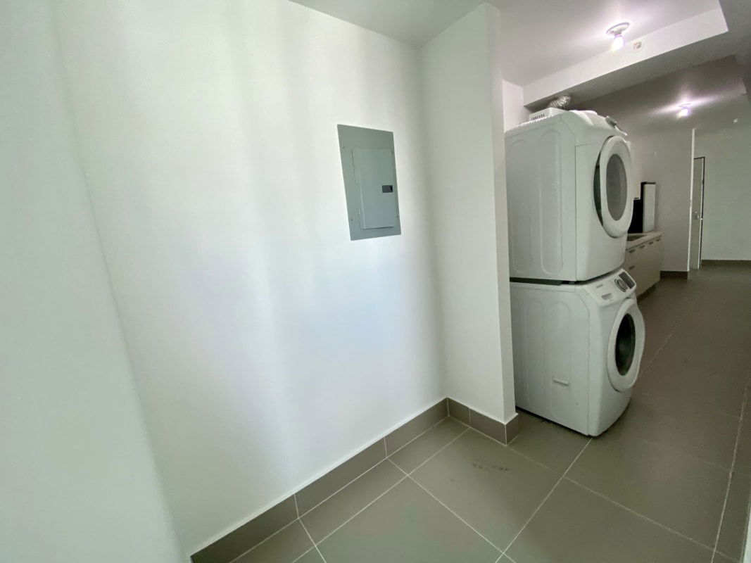 Spacious master bedroom with ocean skyline view windows in PH Miramar Panama