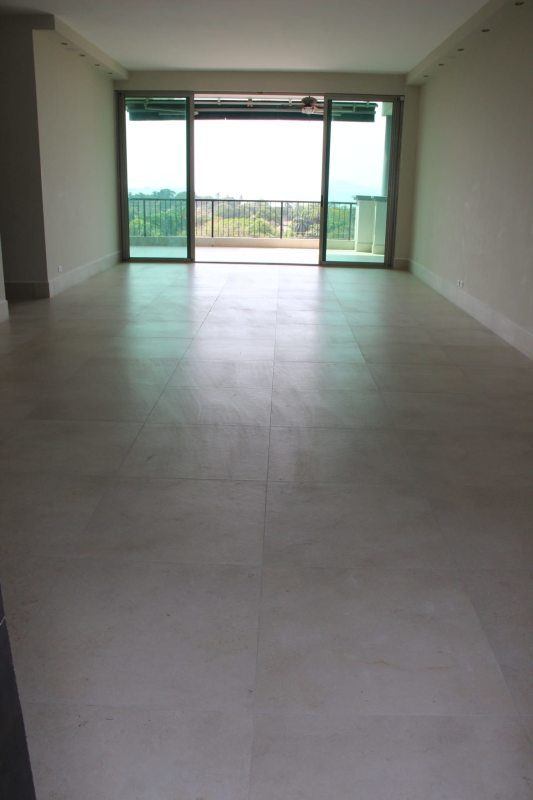 Spacious master bedroom with private balcony access and canal views at Altos de Amador Panama