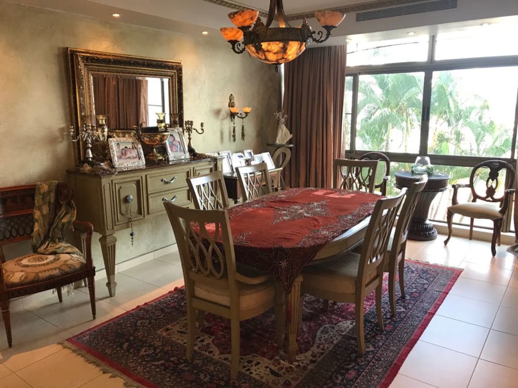 Mediterranean-inspired exterior with covered carport in Dos Mares luxury home