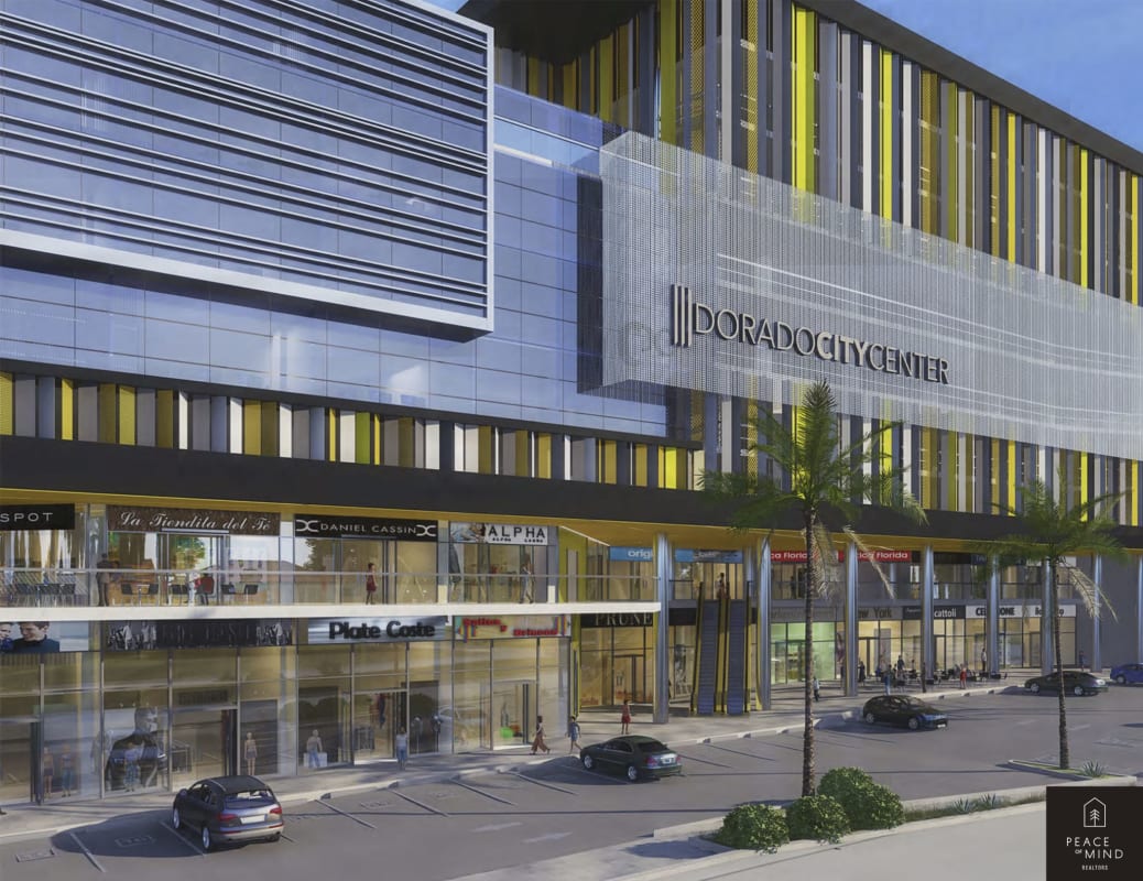 Multi-story complex with glass storefronts and signage at Dorado City Center commercial hub Panama.