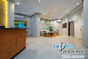 Bright living room with balcony overlooking Pacific ocean golf course at Coronado Golf Panama