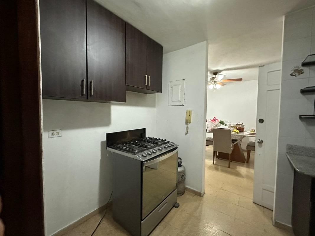 Gas stove wood cabinets dining area glimpse PH Plaza del Golf Panama City