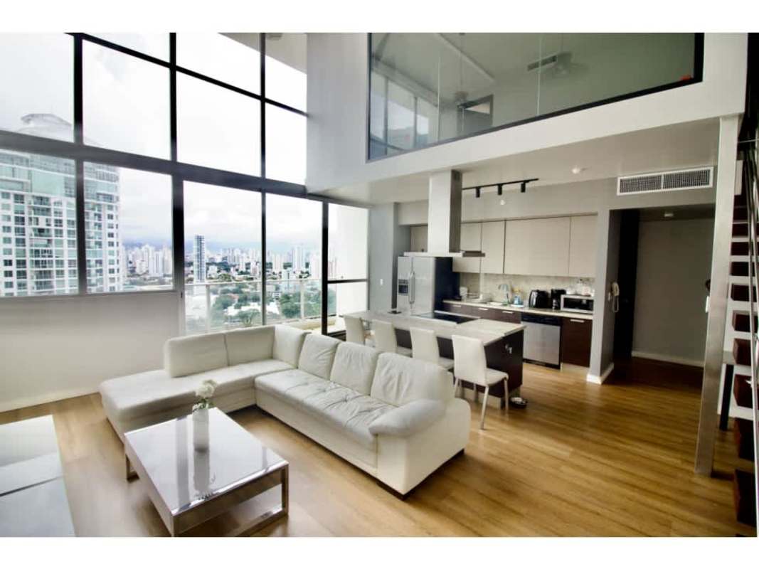 Open loft living space with city views, double height windows at PH Oceanaire Punta Pacifica Panama