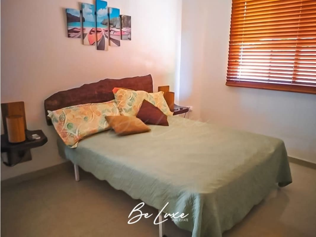 Cozy furnished bedroom facing ocean Isla Saboga real estate Panama