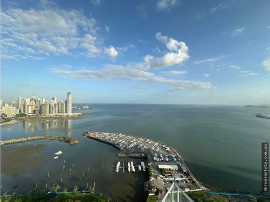 Bright master bedroom with direct access to balcony ocean views PH Yacht Club Panama City