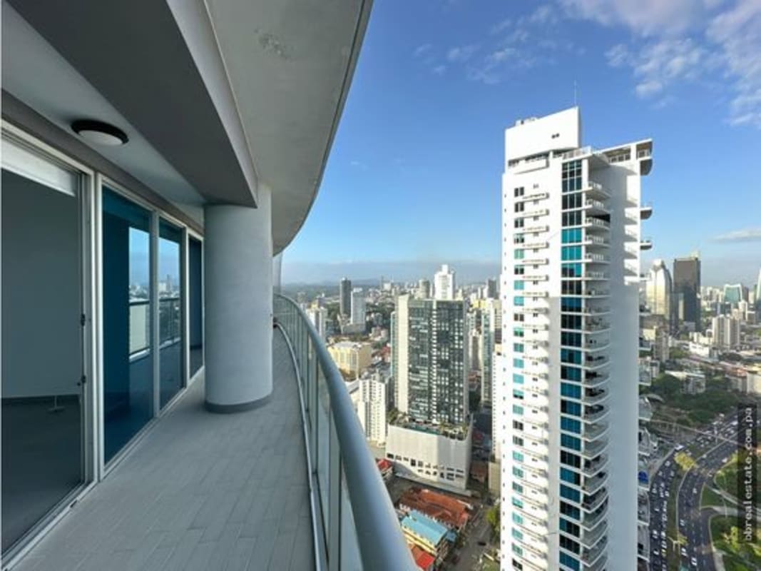 Open-concept luxury kitchen with granite countertops island stainless steel appliances in PH Yacht Club Avenida Balboa Panama