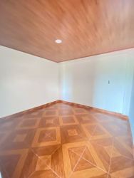 Empty bedroom or office space with wood ceiling and tile floor Puerto Pilón