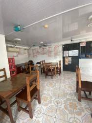 Exterior staircase tiled steps covered roof Puerto Pilón Colón