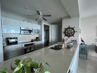 Elegant bedroom with king bed, large window, ocean vistas in PH Casa Bonita Playa Bonita