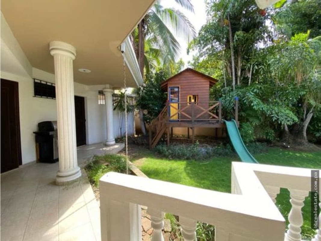 Spacious garden with terrace columns children's playground at house for sale Panama