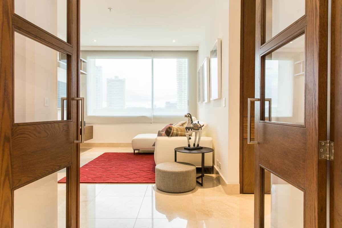 Spacious bedroom with large windows and ensuite bath luxury apartment PH Aria Panama
