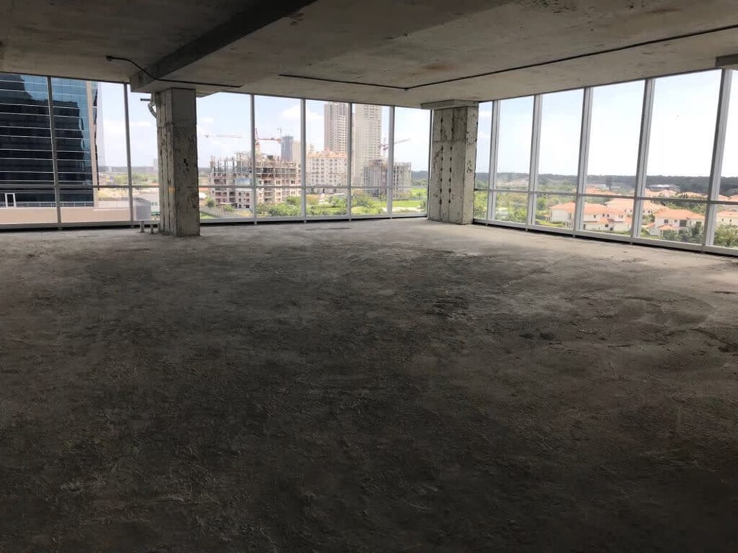 Gray shell interior open plan commercial floor panoramic windows skyline Santa Maria District Panama